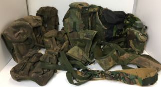 Eleven camouflaged items including bags, mittens,
