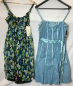 Two dresses; Laura Lees black, green and blue size M,