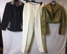 Three garments; Cojana dark grey jacket with grey astrakhan trim, Jaeger cream lined trousers,