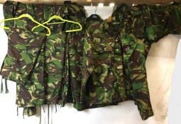 Six combat camouflage garments including four shirts and two pairs of trousers (CWH Ref: In blue