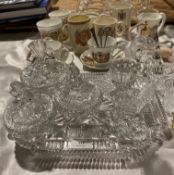 Ten commemorative items; cups/mugs, spoons, saucers, glass perfume bottles,