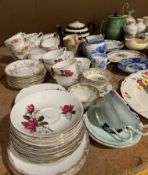 Contents to middle of rack - cups, saucers, jugs, teapots,