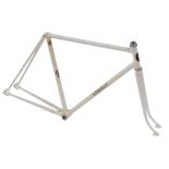 A Cinelli bicycle frame and fork set, with enamelled head badge, white with applied decals.