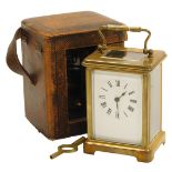 An early 20thC French brass cased carriage clock, the rectangular enamel dial bearing Roman