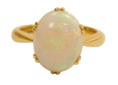 A 22ct and opal solitaire ring, in an oval setting, size O, 7.1g.