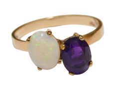 A 9ct gold opal and amethyst ring, in a staggered claw setting, size P, 2.1g.