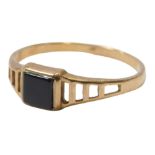 A 9ct gold black onyx signet ring, the ring head square set, on pierced and stepped shoulders,