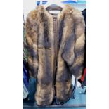 A fur coat, three quarter length, size unknown.
