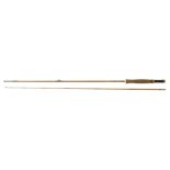A Haywood Zepher 7ft two-piece cane fishing rod, with a cloth bag.