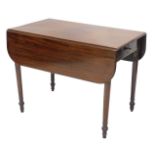 A 19thC mahogany drop leaf Pembroke table, the frieze drawer with later brass knob handle, on turned
