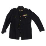 A vintage Royal Tank Regiment No. 1 service dress blue tunic, with various brass RTR buttons, tank