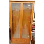 A G-plan teak freestanding cabinet, of rectangular form with drawer beneath, 81cm high, 86cm wide,