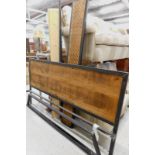A modern super king size bed, with metal frame and rustic wooden panelled section, 101cm high, 184cm
