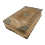 An 18thC Holy Bible, calf bound with metal mounts, printed by John Baskett, Oxford, 1739.
