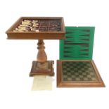 A Studio Anne Carlton Battle of Hastings resin chess set, contained in an oak chess table, 62cm