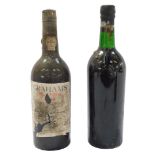 A bottle of Graham's Malvedos 1968 vintage port, together with a bottle of Graham's 1963 port,