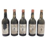 Five bottles of Warre's Tercentenary 1970 vintage port, each bearing a partial wax seal and paper