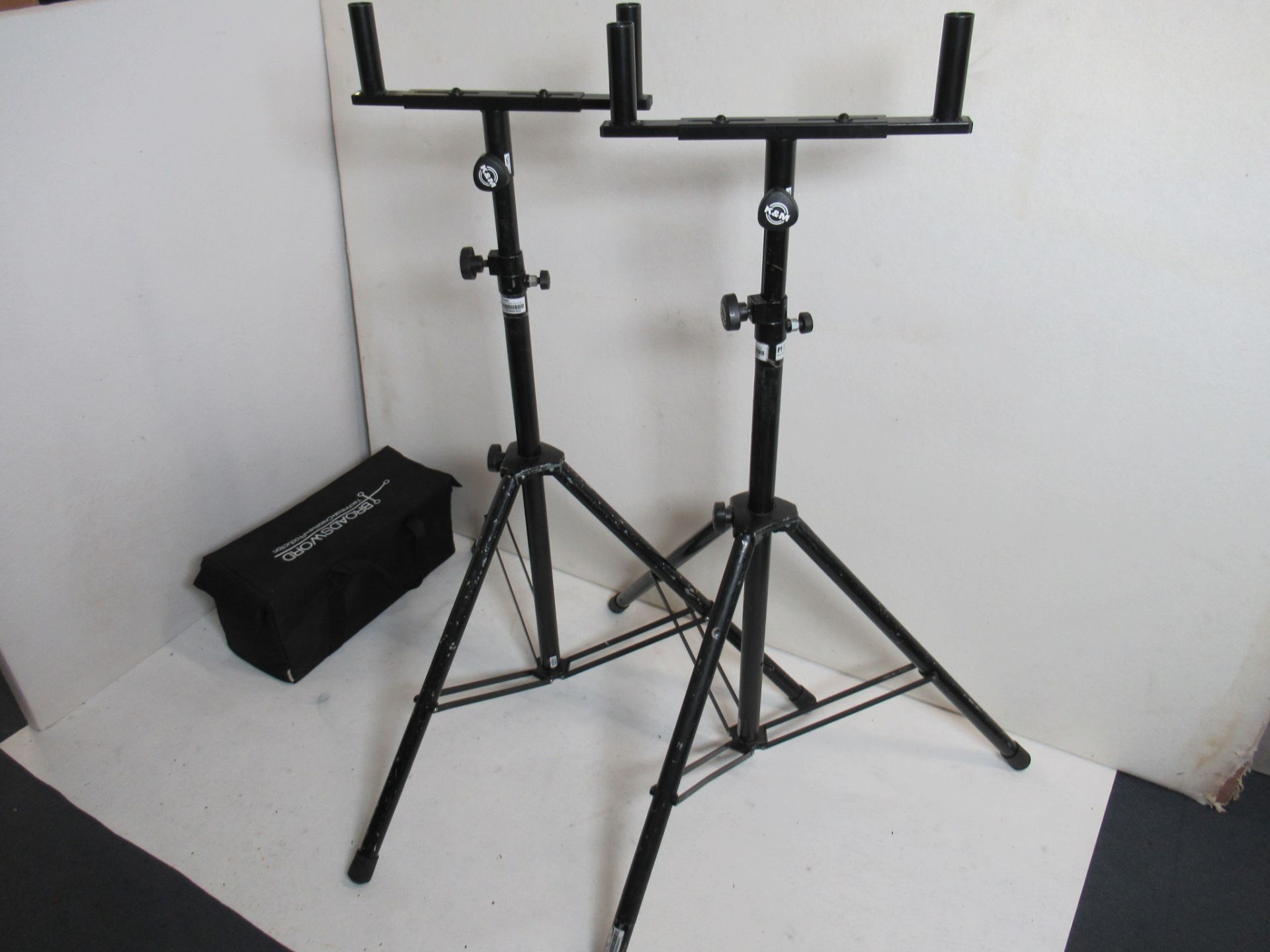 (2) K&M black telescopic tripod speaker stands with (2) bull bars and soft bag