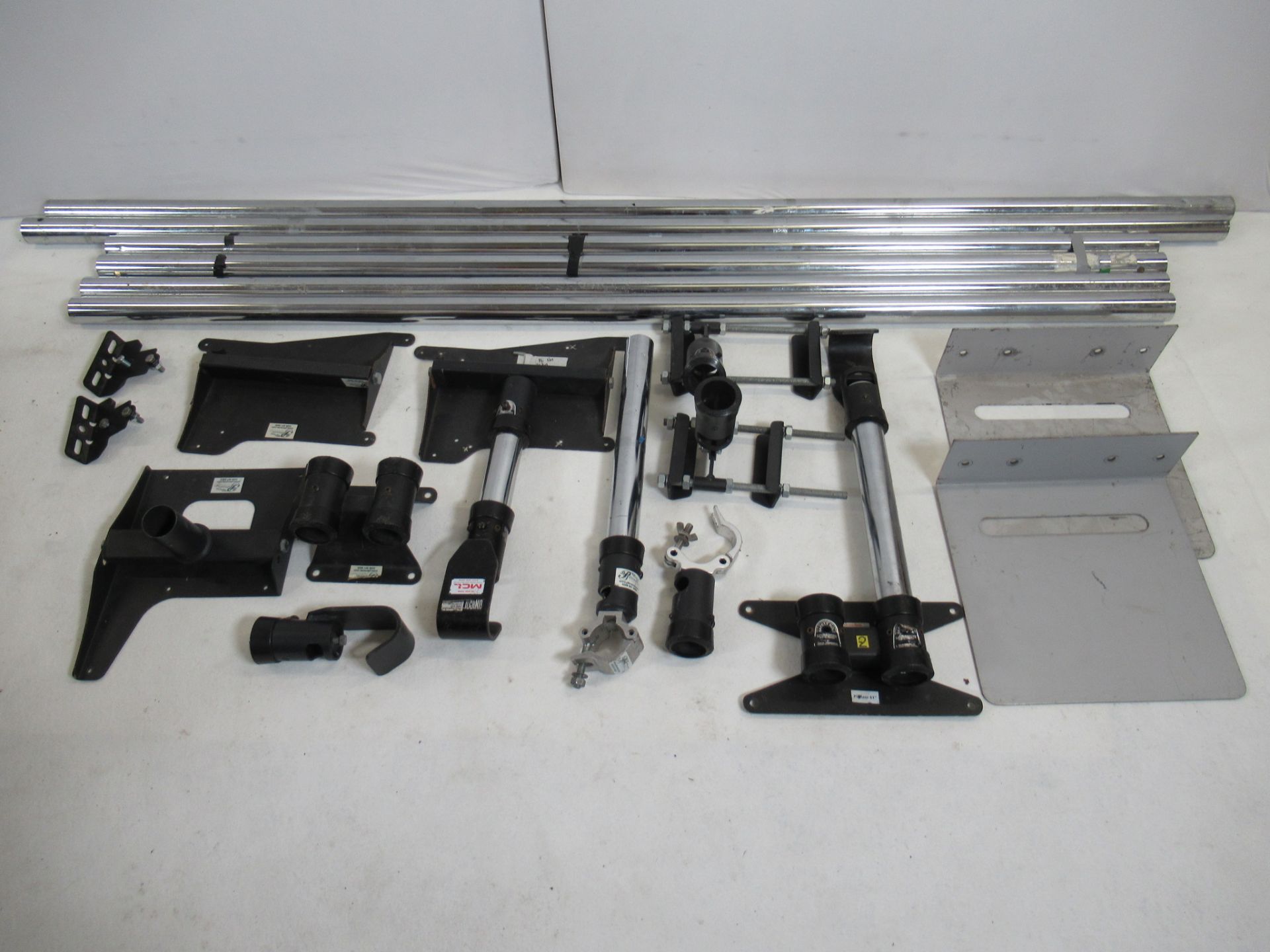 Assorted Unicol poles, projector mounts