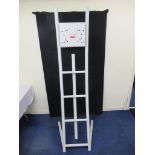 White tubular steel screen stand