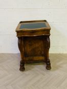 A Victorian burr and figured walnut davenport with carved cabriole supports