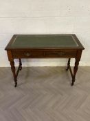 An Edwardian two drawer writing table