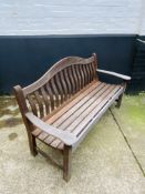 A slatted hardwood garden bench