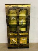 A decorative contemporary Chinese chinoiserie style lacquered four door cabinet