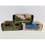 A collection of three 'Burago' 1/24 scale scale boxed model cars