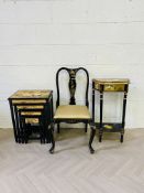 A collection of three items to include a contemporary Chinese lacquered nest of four tables