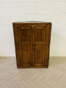 An 18th century oak corner cupboard
