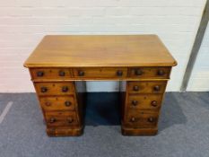 A 19th century mahogany rounded corner three part pedestal desk