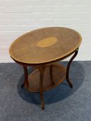 An Edwardian mahogany oval shaped occasional table