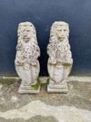 An attractive pair of weathered lions resting upon shields