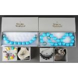 Four boxed items of Vivienne Westwood plastic and metal costume jewellery, comprising oversized