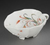 A mid 18th century Chinese Kakiemon leaf shaped handled vessel, the interior painted with two