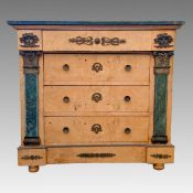 A 19th century Empire style marble topped satin birch chest of three drawers, applied mask and
