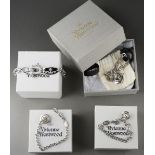 Four boxed Vivienne Westwood orb charm bracelets, three with crystal encrusted orb suspended from