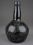 A Victorian Scottish Folk Art engraved brown glass wine bottle of onion form, stipple decorated with