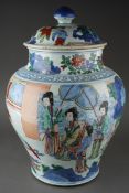 A 19th Century Kangxi style Chinese Wucai large baluster jar and cover decorated with an interior