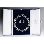 A Georg Jensen Hans Hansen silver necklace and earring set. The necklace designed as a series of