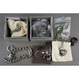 Five pieces of Vivienne Westwood costume jewellery, comprising a black enamel stamp "1st Open 24hrs"