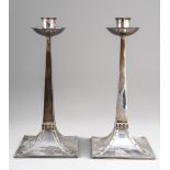 A pair of Arts & Crafts silver candlesticks after a design by Jan Eisenloeffel Amsterdam School,