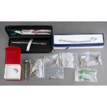 Collection of silver jewellery to include Jade style drop earrings, charms Scottish brooch, charm