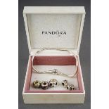 White metal bracelet, marked pandora, together with 5 charms