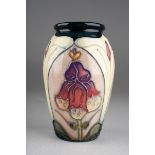 A Moorcroft Foxglove vase designed by Sally Tuffin, impressed and gilt marks, approx 10.5cm high [