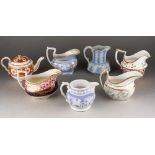 A collection of 19th Century cream jugs to include: 1. Coalport with central cobalt blue and gilt,