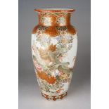A Meiji period Japanese Kutani porcelain baluster vase, decorated eith two birds in flight against a