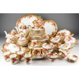 A Royal Chelsea "Rose Garden" six place setting part dinner service including dinner plates, lunch/