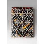 A late Victorian tortoiseshell and mother of pearl inlaid card case, the geometric sections with